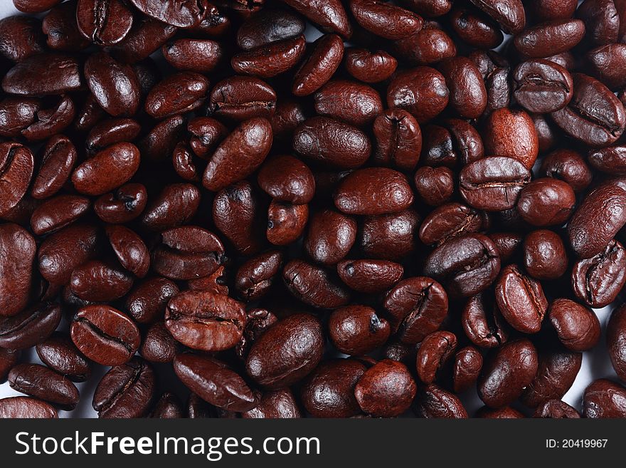 Black coffee fresh beans close up. Black coffee fresh beans close up