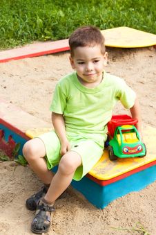 A Little Boy Smiling And Playing In The Toy Car Royalty Free Stock Photography A Little Boy Smiling And Playing In The Toy Car Royalty Free Stock Photography