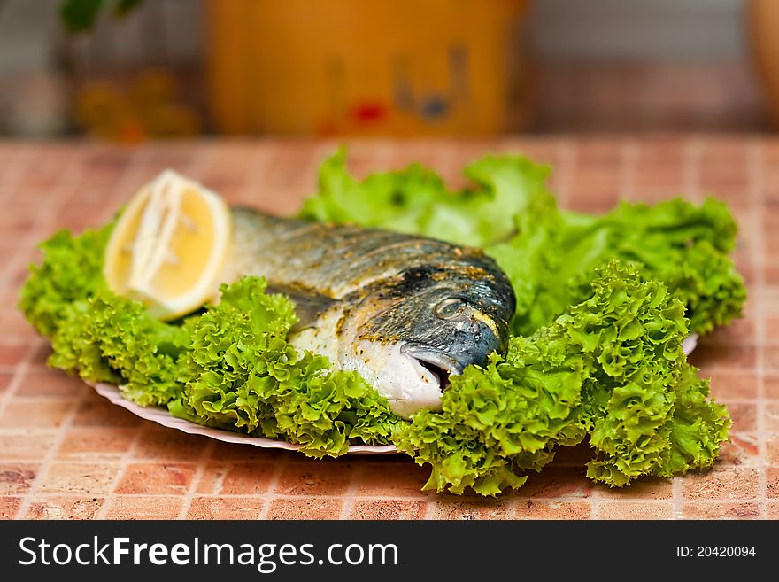 Whole griled dorada fish with vegetables