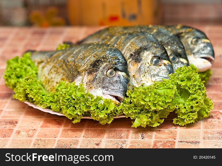 Whole griled dorada fish with vegetables