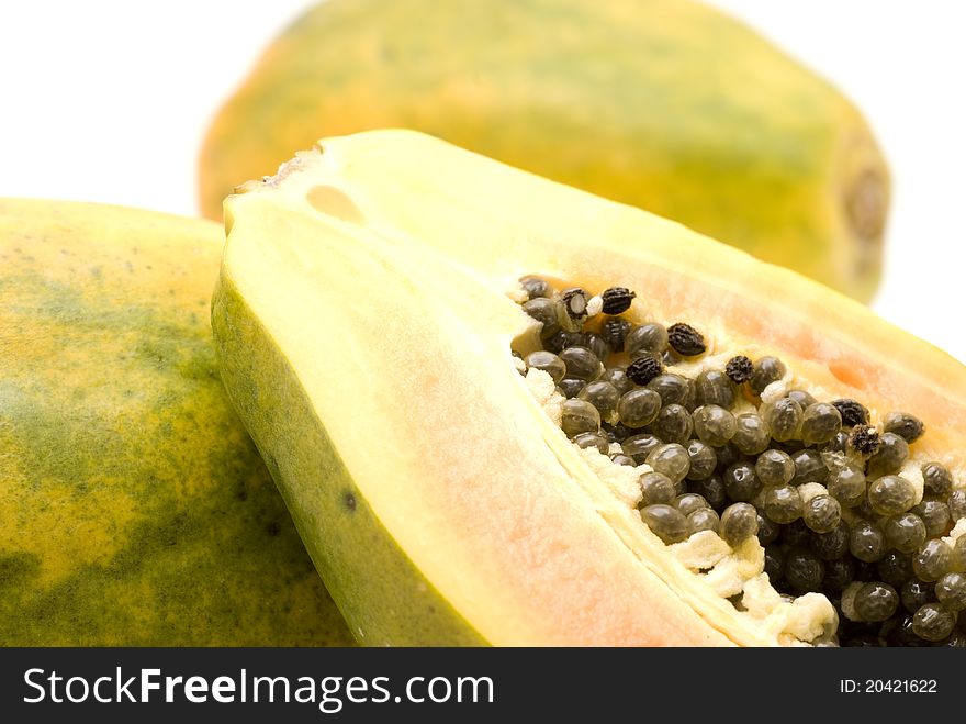 Particularly chopped papaya on a white background. Particularly chopped papaya on a white background