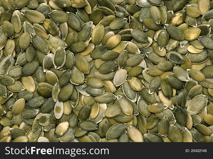 Green pumpkin seeds background