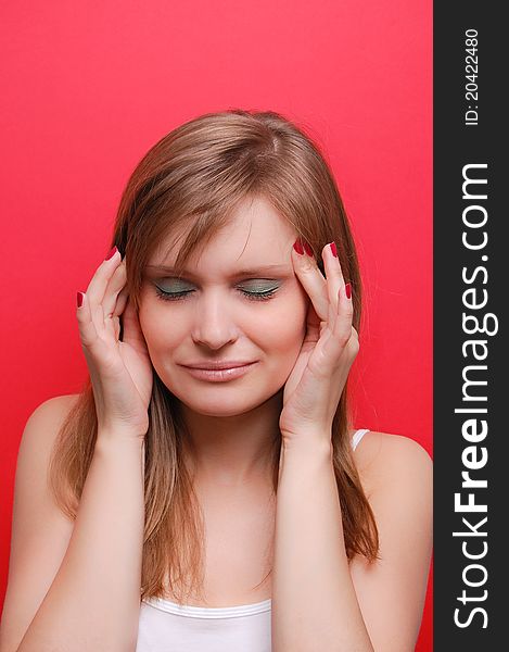 Portrait of a young woman on red