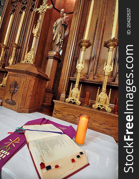 Catholic altar in church. Open Bible