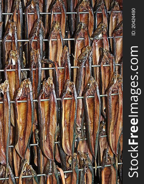 Freshly Smoked Kippers Hanging in a Smoking Cabinet. Freshly Smoked Kippers Hanging in a Smoking Cabinet.