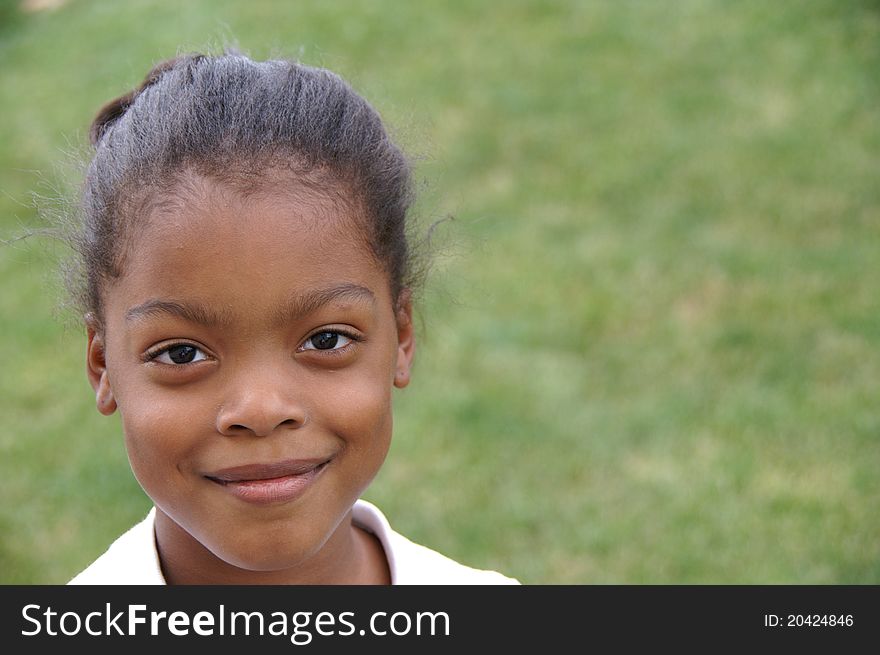 Young African-American girl at the park. Young African-American girl at the park