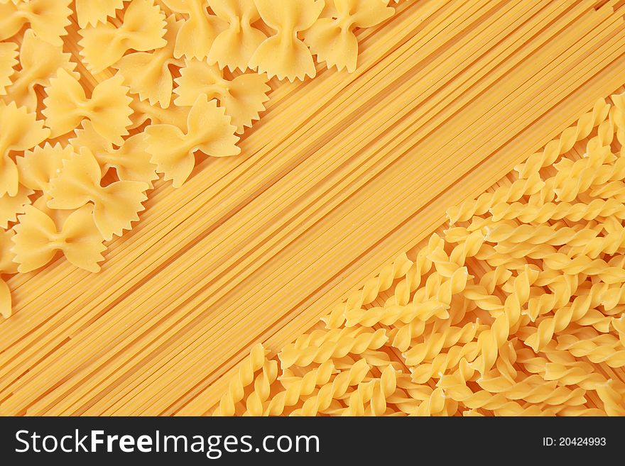 A collection of spaghetti, farfalle and rotini pasta. A collection of spaghetti, farfalle and rotini pasta