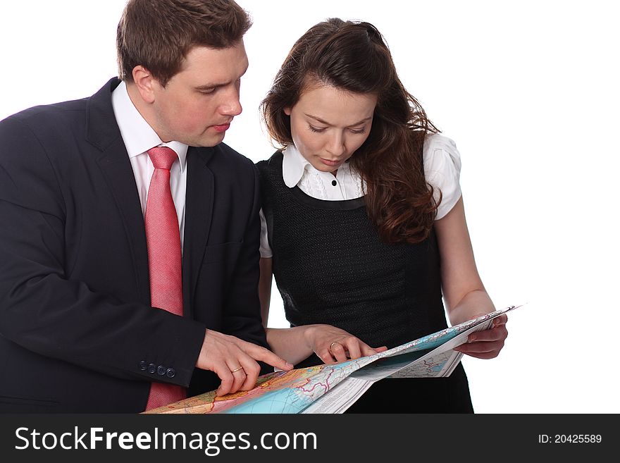 Closeup of a happy casual couple with map isolated on the white