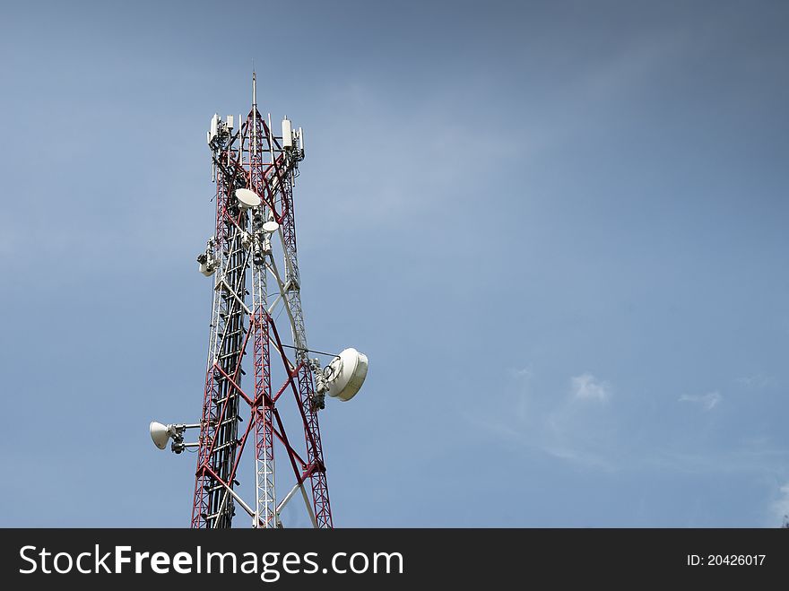 Radio communication tower against blue sky. Radio communication tower against blue sky
