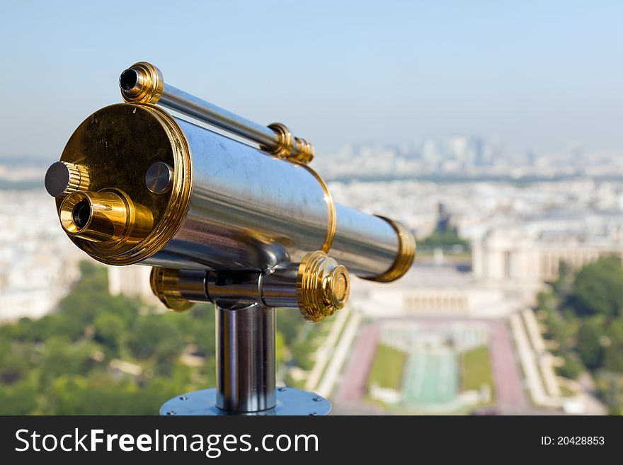 View of a telescope from high up on the Eiffel Tower. View of a telescope from high up on the Eiffel Tower