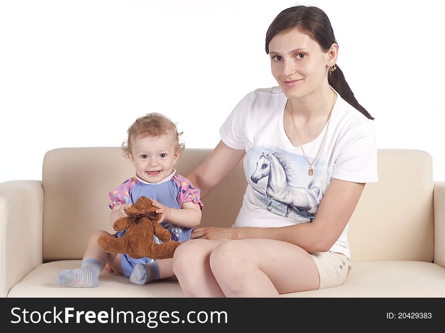 Nice mom with her daughter on a white. Nice mom with her daughter on a white