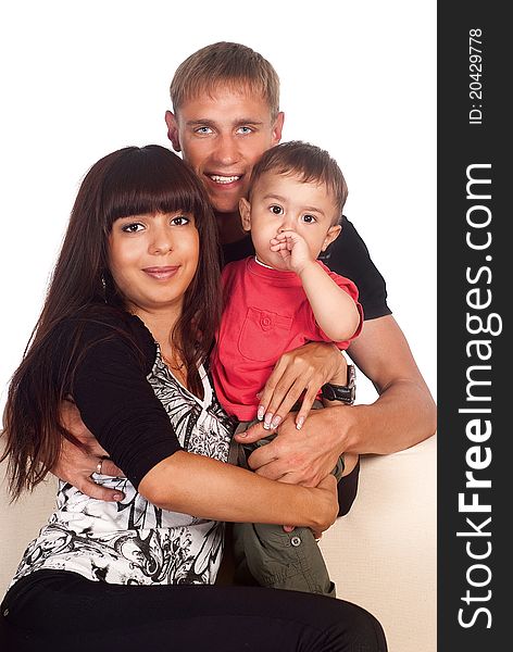 Portrait of a nice family of a three on sofa. Portrait of a nice family of a three on sofa