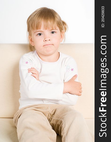 Portrait of a little girl on sofa