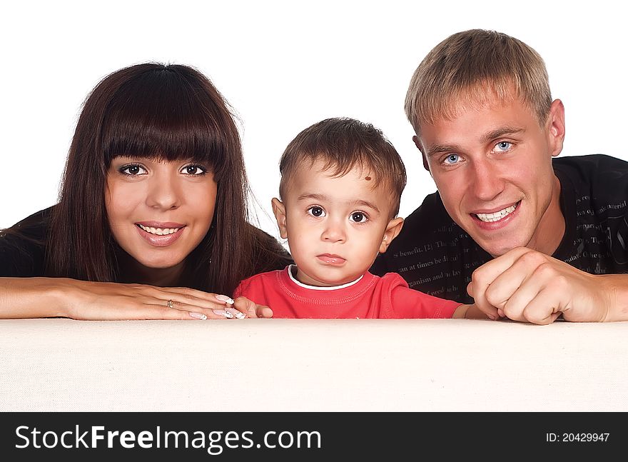 Portrait of a nice family of a three on sofa. Portrait of a nice family of a three on sofa