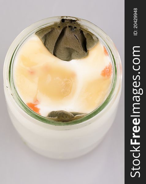 Yogurt with mold in glass jar