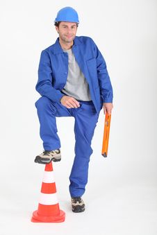 Builder With Foot On Traffic Cone. Stock Photos Builder With Foot On Traffic Cone. Stock Photos