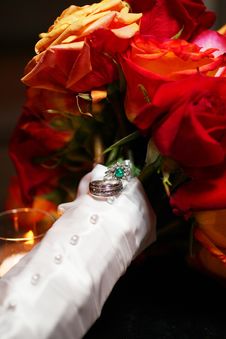 Wedding Rings On Rose Bouquet Stock Photos