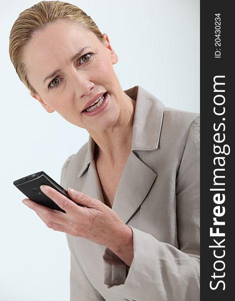 Closeup of a businesswoman holding cell-phone. Closeup of a businesswoman holding cell-phone