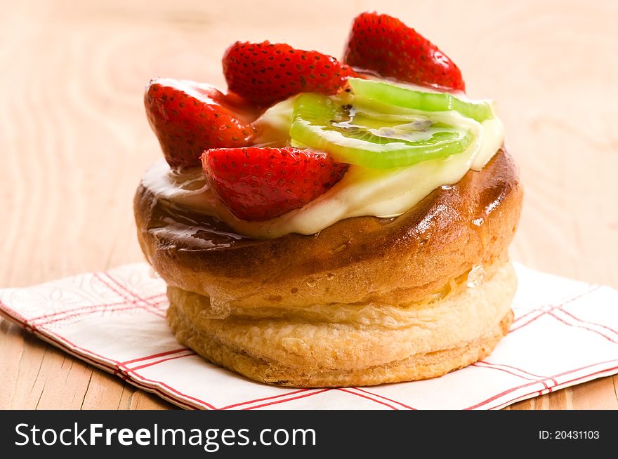 Cake with fresh fruits - strawberry and kiwi