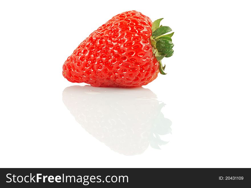 A single strawberry lying on the white background.