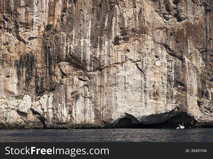 Nautical vessel close to mountain wall and The Mediterranean Sea on Majorca, Spain. Nautical vessel close to mountain wall and The Mediterranean Sea on Majorca, Spain.