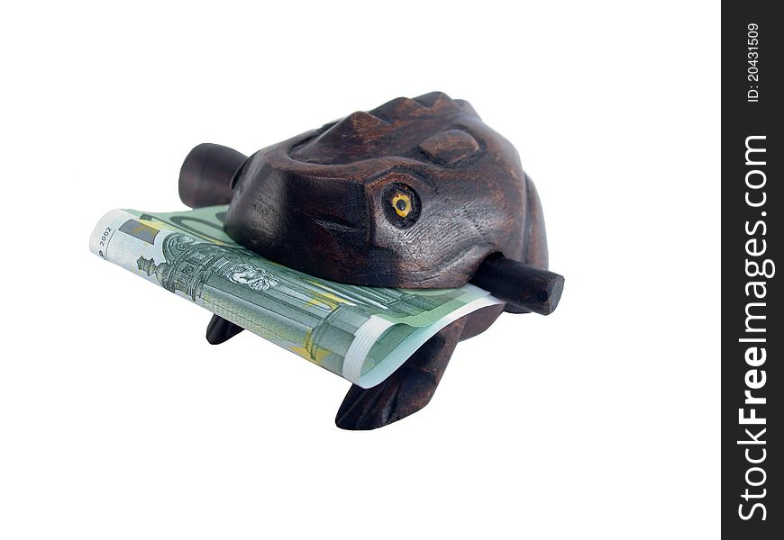 Souvenir frog with banknotes on a white background. Souvenir frog with banknotes on a white background