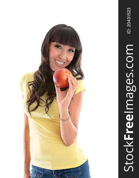 Attractive smiling woman eating a healthy choice food snack. She is holding a ripe red apple in her left hand. Attractive smiling woman eating a healthy choice food snack. She is holding a ripe red apple in her left hand.