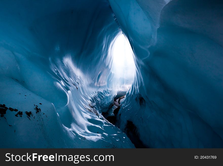 The path inside the ice cave in the glacier. The path inside the ice cave in the glacier