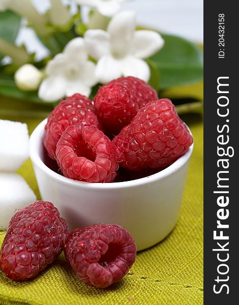 Some fresh seasonal summer raspberries with yogurt. Some fresh seasonal summer raspberries with yogurt