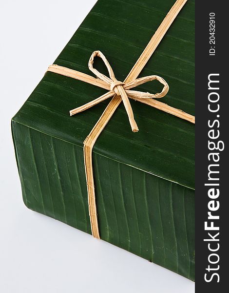 Gift box wrapped with banana leaf, ribbon and rope made from banana bark. Gift box wrapped with banana leaf, ribbon and rope made from banana bark.