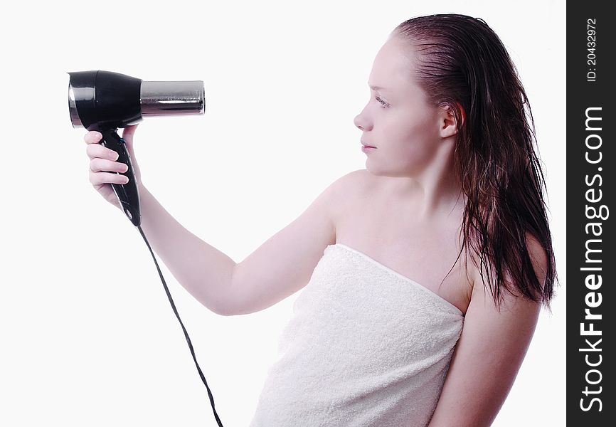 Soft picture of girl after shower with hairdryer