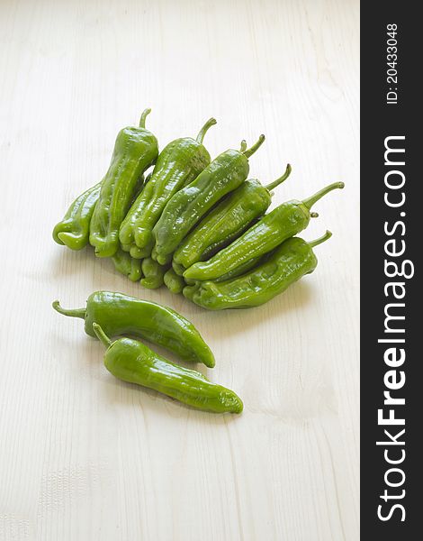 Sweet green peppers on a wooden table