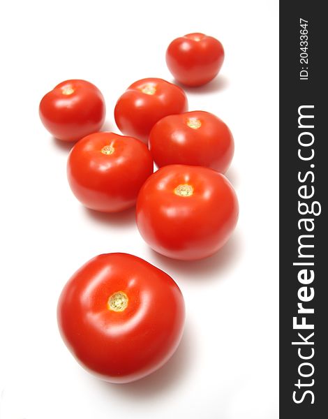 Red tomatoes on white background