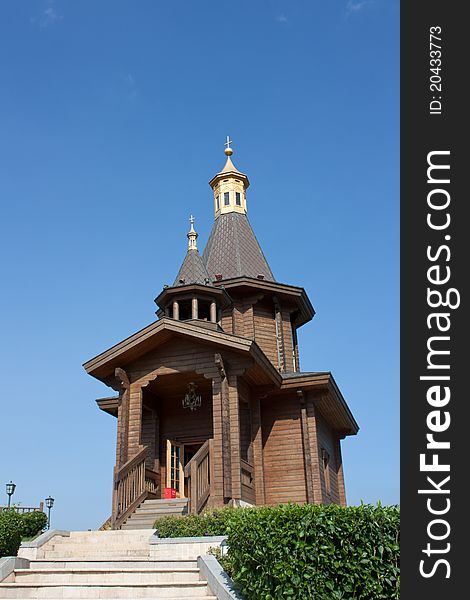 Small wooden church with golden rooftop