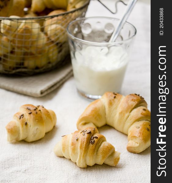 Homemade baked pastry on the table with a glass of milk. Homemade baked pastry on the table with a glass of milk