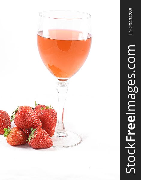 A Glass of pink wine and fresh strawberries. A Glass of pink wine and fresh strawberries.