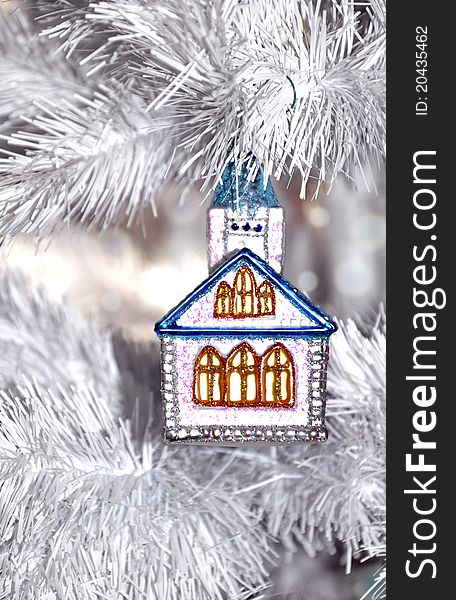 Little house Christmas ornament on a white Christmas tree. Little house Christmas ornament on a white Christmas tree