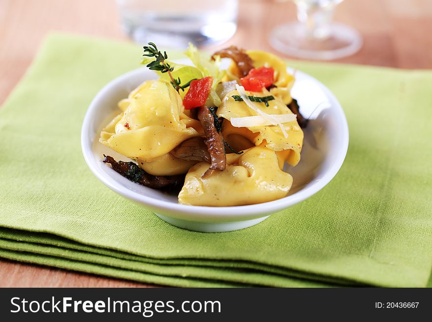 Italian cuisine - Stuffed pasta and mushrooms. Italian cuisine - Stuffed pasta and mushrooms