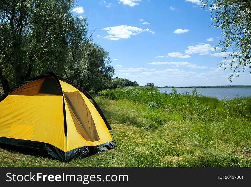 Tent yellow on the bank of lake. Tent yellow on the bank of lake