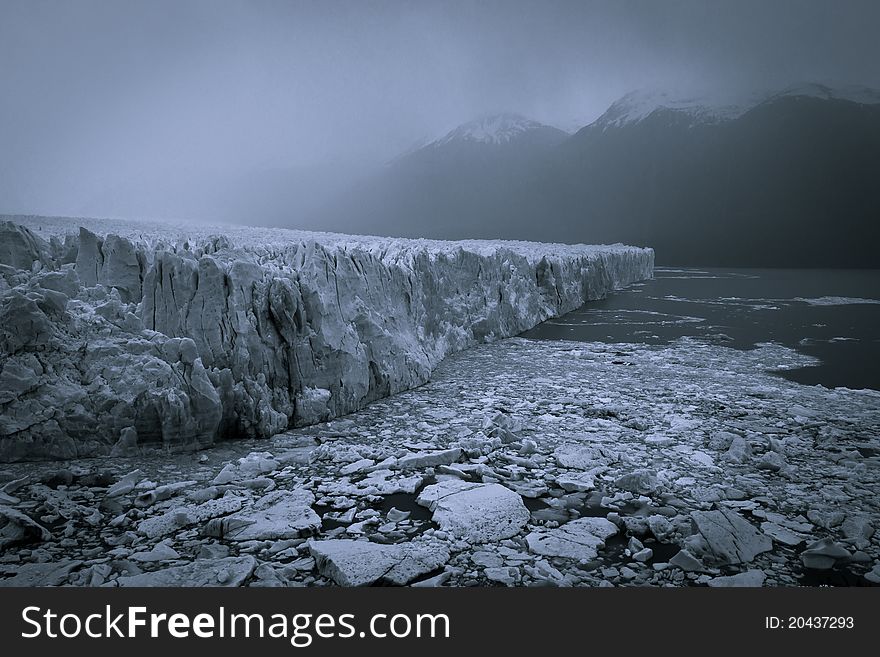 Rain and Haze over Perito Moreno Glacier in Los Glaciares National Park in Argentina