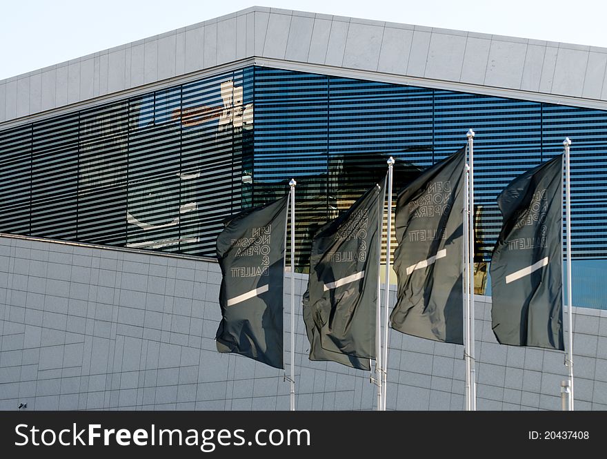 Picture of the 4 flags of Oslo opera, and the proud building in the bacground. Picture of the 4 flags of Oslo opera, and the proud building in the bacground