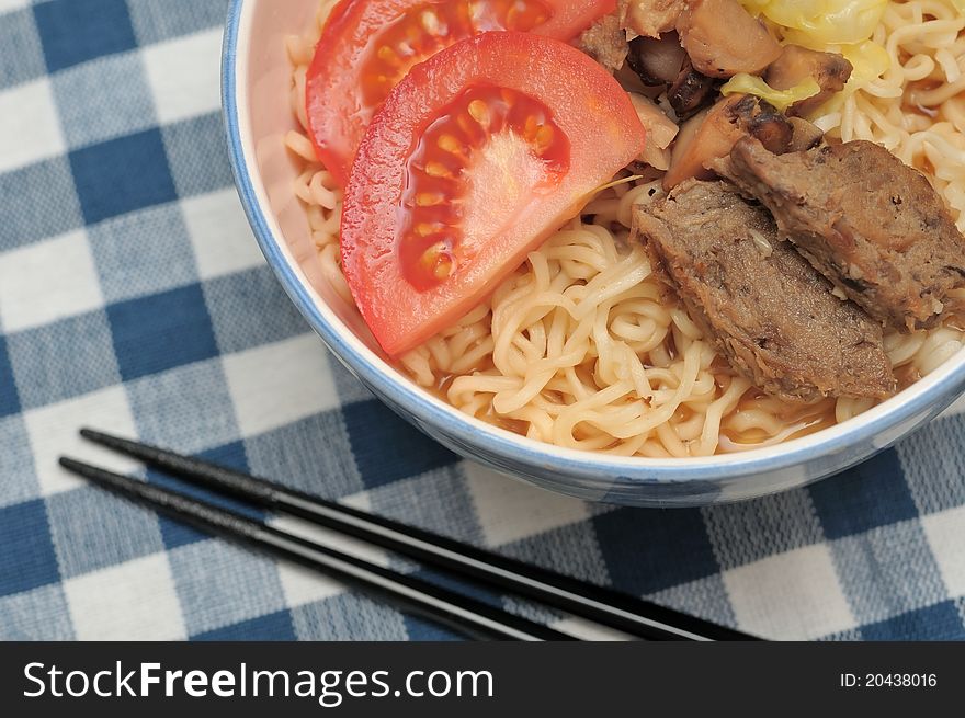 Closeup shot of healthy meat noodles prepared with fresh vegetables and vegetarian mutton slices. Closeup shot of healthy meat noodles prepared with fresh vegetables and vegetarian mutton slices.