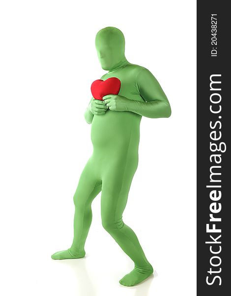 A green morphed man holding a red heart to his chest. Isolated on white. A green morphed man holding a red heart to his chest. Isolated on white.