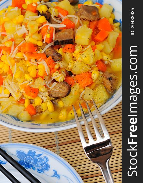 Asian style potato stew dish as main course. Asian style potato stew dish as main course.