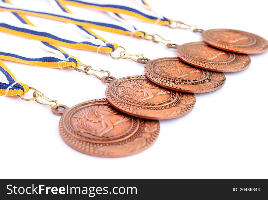 Medals on white background, horizontal picture.