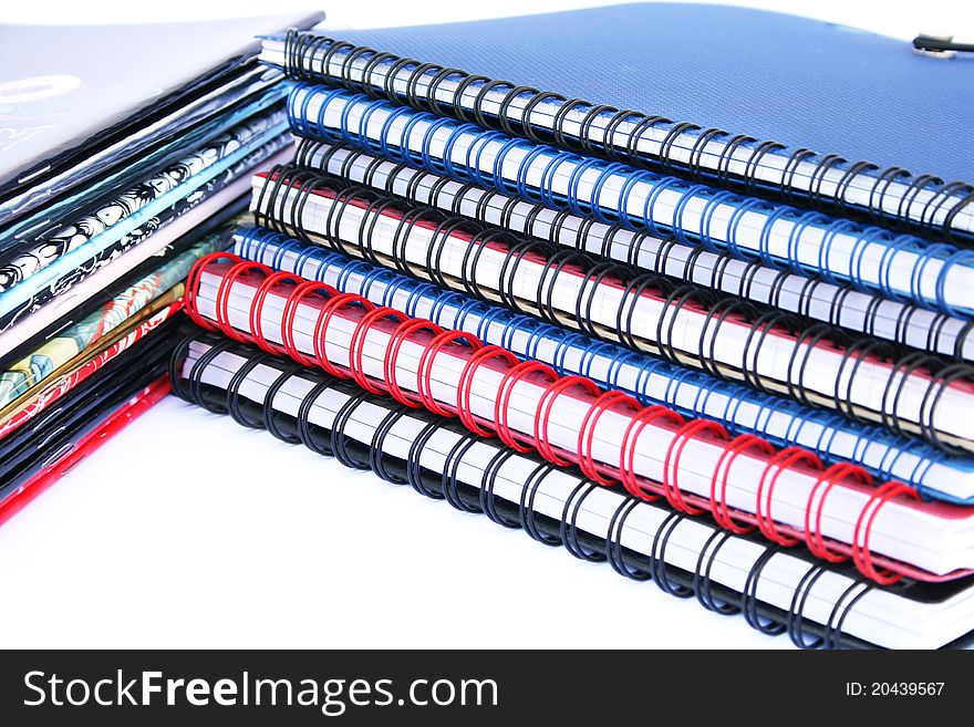 Copybook stacks on white background.