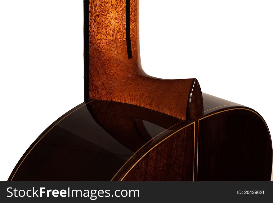 A spanish classical guitar seen from the rear, close-up of the heel and neck where it attaches to the body of the guitar, made of dark wood. A spanish classical guitar seen from the rear, close-up of the heel and neck where it attaches to the body of the guitar, made of dark wood.