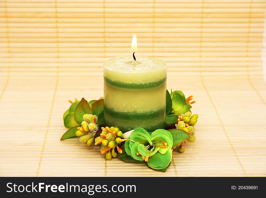 Candles and flowers on bamboo background. Candles and flowers on bamboo background.
