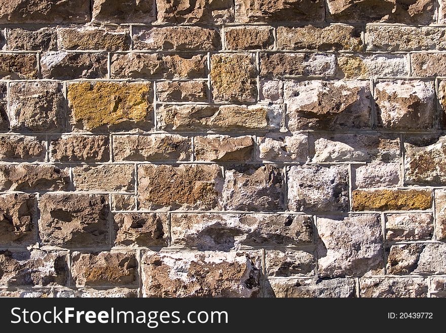 Old wall of stone with natural texture for a background. Old wall of stone with natural texture for a background