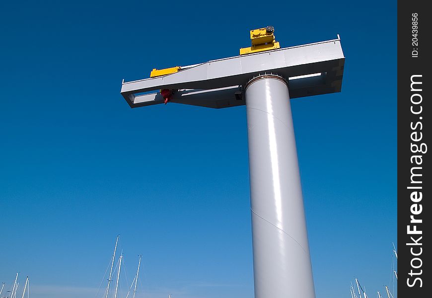 Boat lifter crane in a marina ready for work horizontal image. Boat lifter crane in a marina ready for work horizontal image